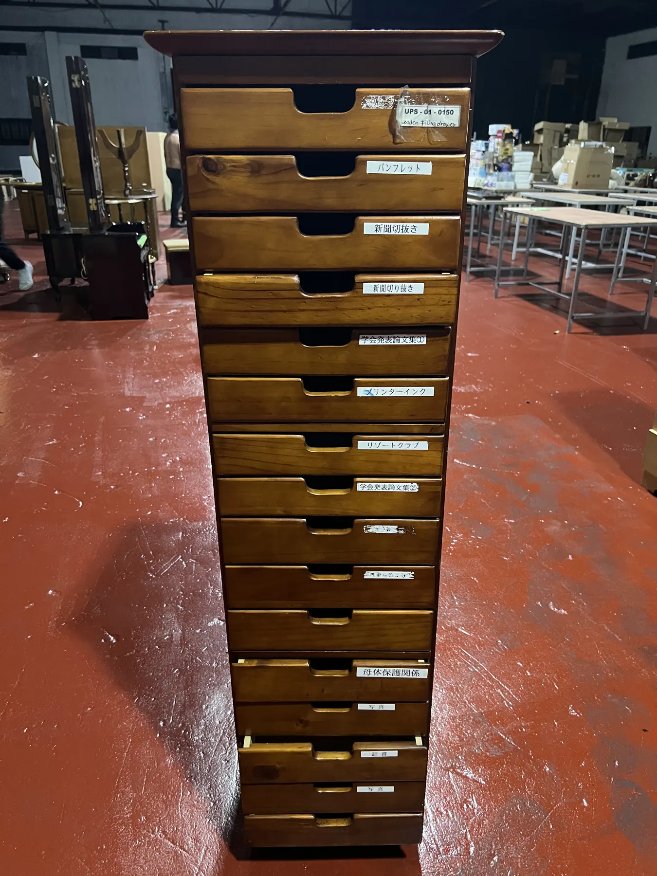 Tall narrow wooden multi-drawer chest