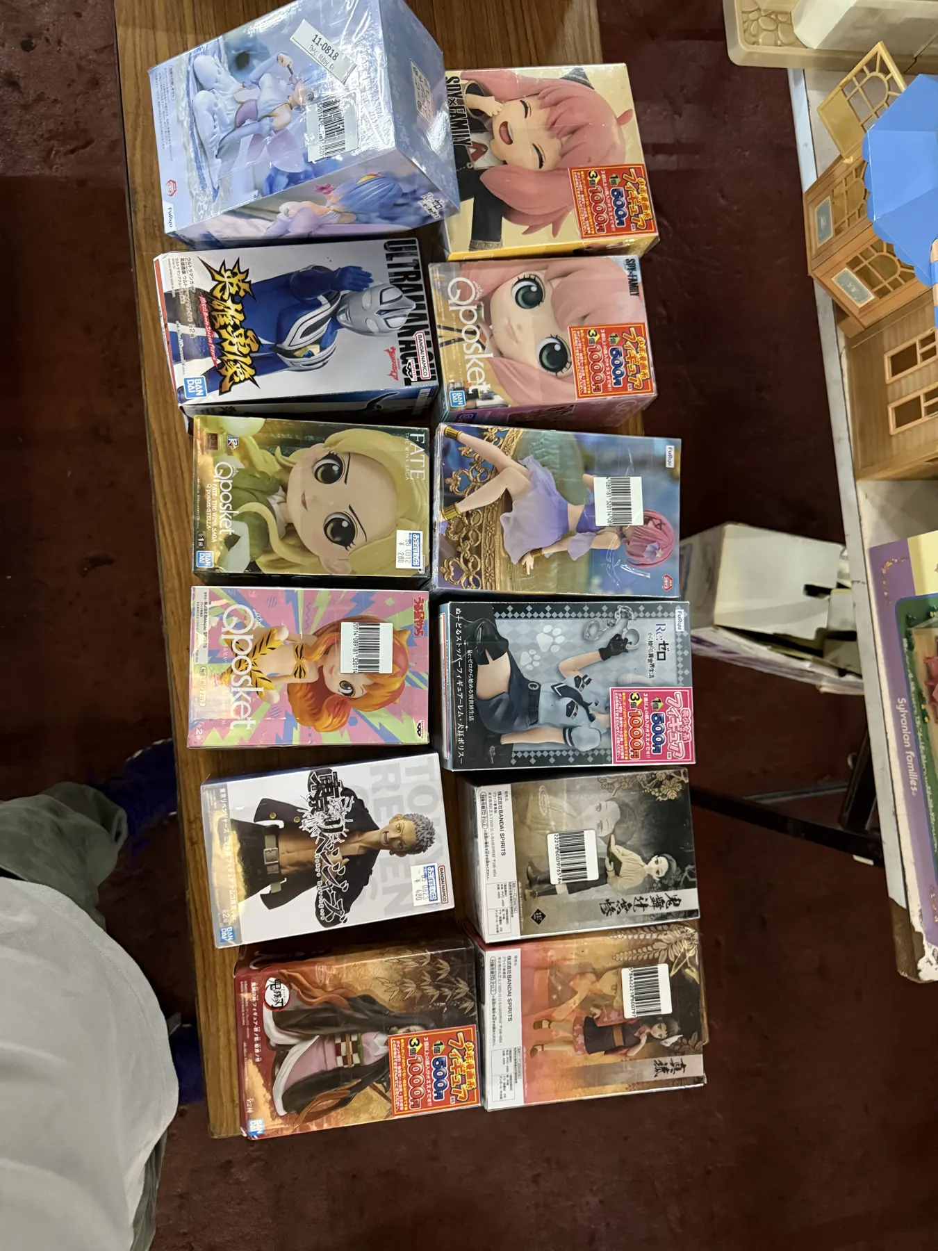 Boxed anime figures arranged on a table