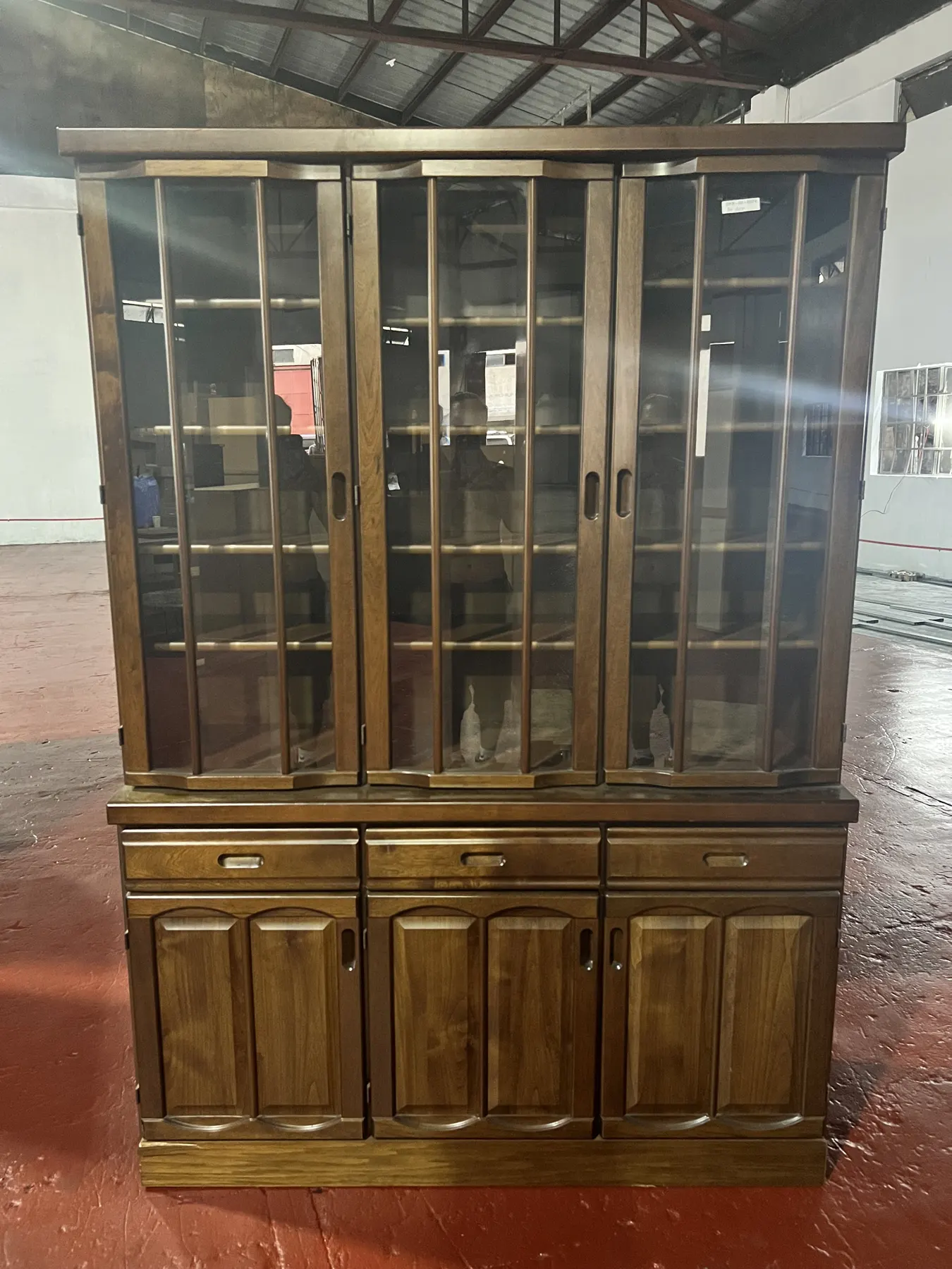 Dark wood glass-front display cabinet