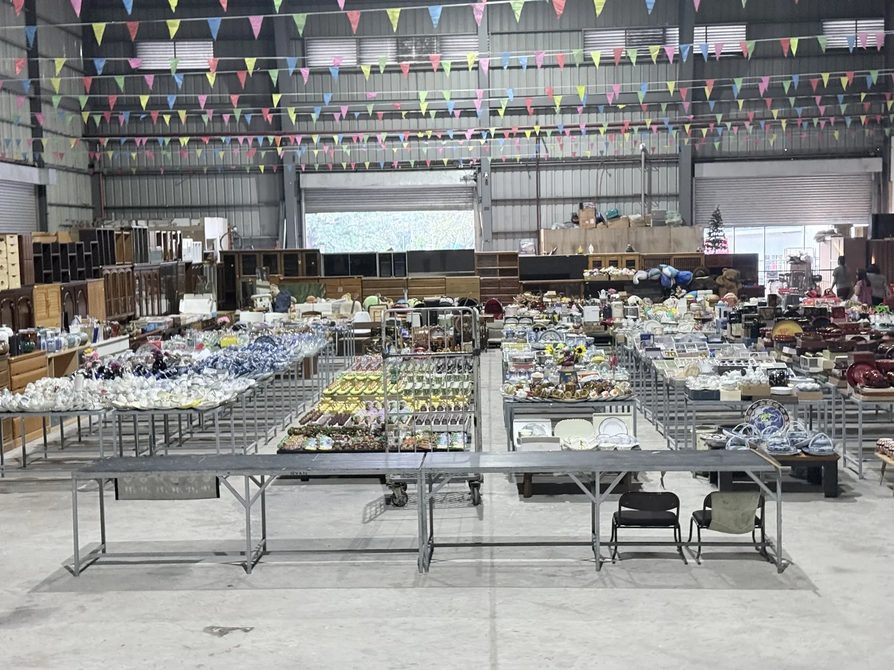 Our warehouse floor covered with tables of Japanese tableware